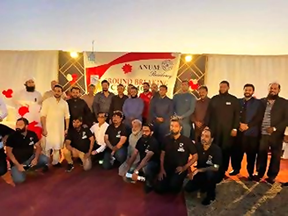 The Anum Builders team and guests under a Ground Breaking banner