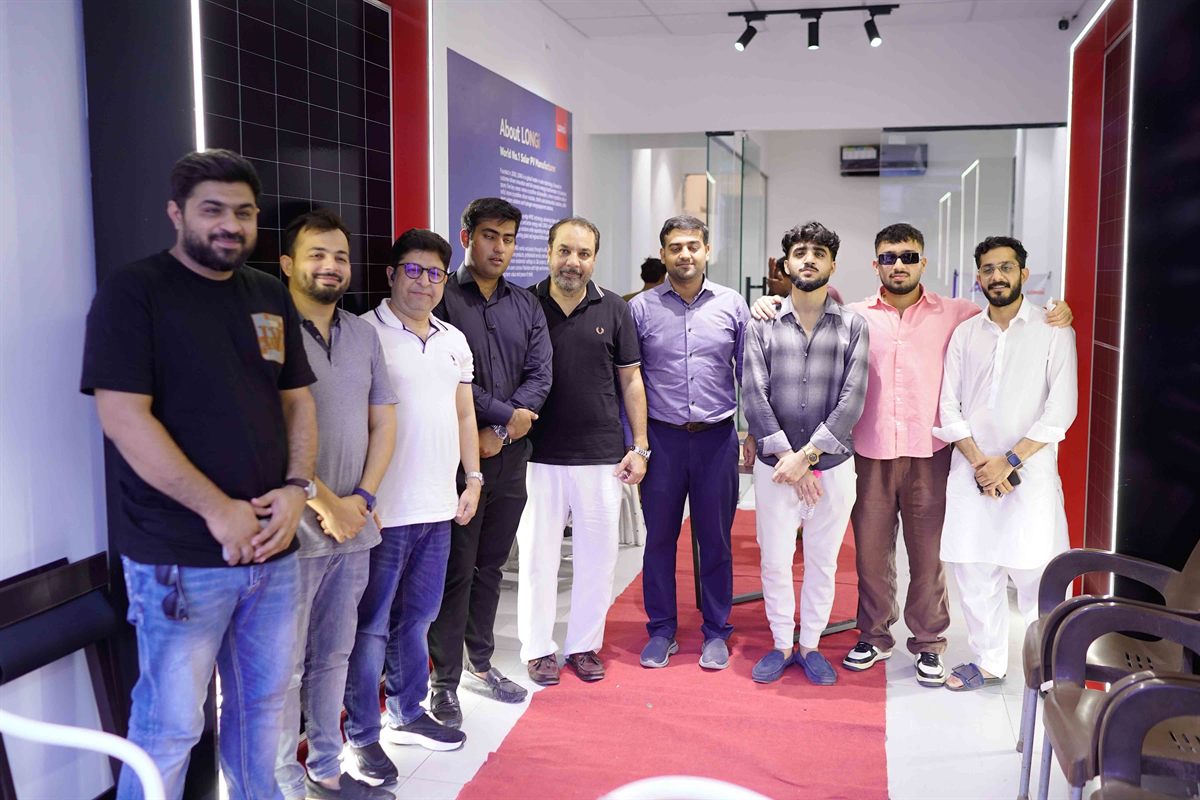 The team on the red carpet inside the LONGi Experience Store