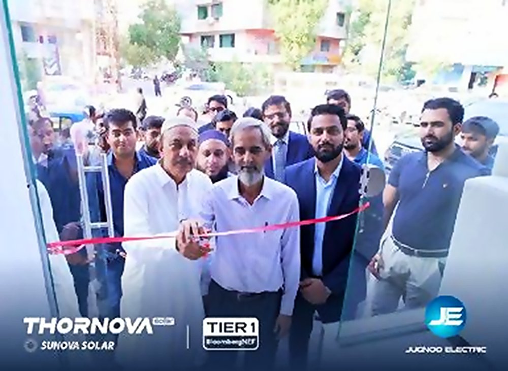 Elders cutting a red ribbon at a Thornova and Jugnoo Electric store opening